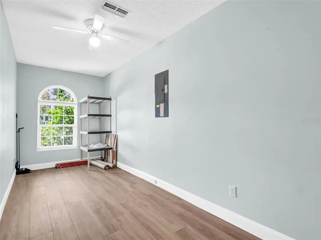 a aerial view of a house with a yard and potted plants