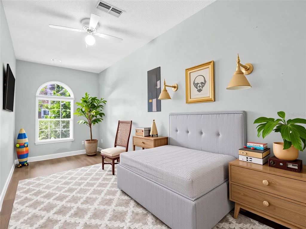 640 Kenneth Way Tarpon Springs, FL 34689 - Photo 38 of 84 a bedroom with a bed and a window