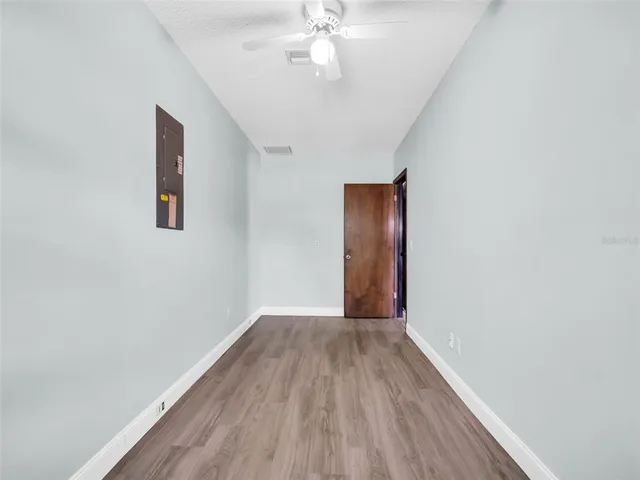 an aerial view of a house with a yard and garden