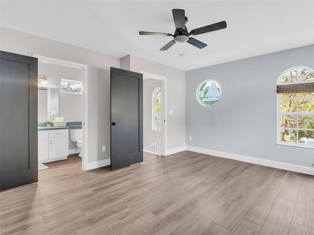 640 Kenneth Way Tarpon Springs, FL 34689 - Photo 42 of 84 a view of empty room with wooden floor and window