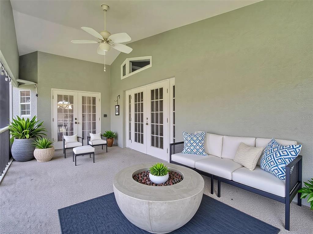 640 Kenneth Way Tarpon Springs, FL 34689 - Photo 46 of 84 a living room with furniture and a large window
