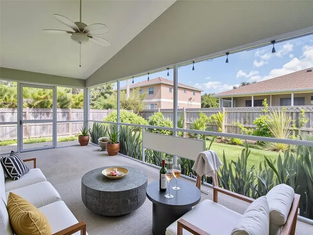a view of a swimming pool with a lawn chairs