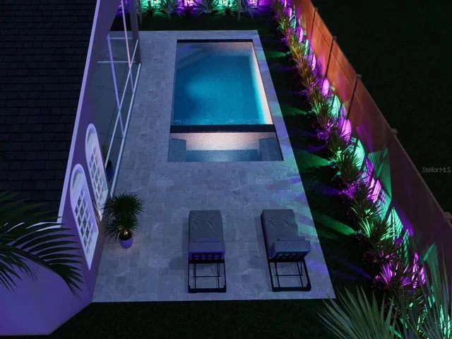 a view of a yard with plants and trees