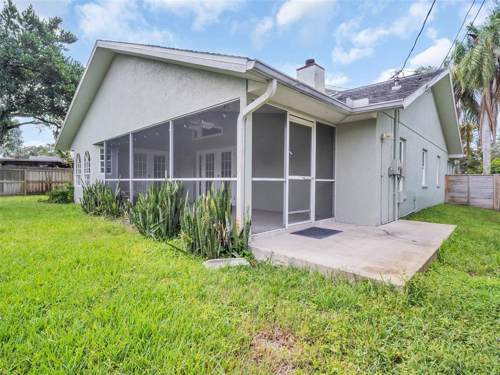 640 Kenneth Way Tarpon Springs, FL 34689 - Photo 54 of 84 a front view of a house with a yard and porch