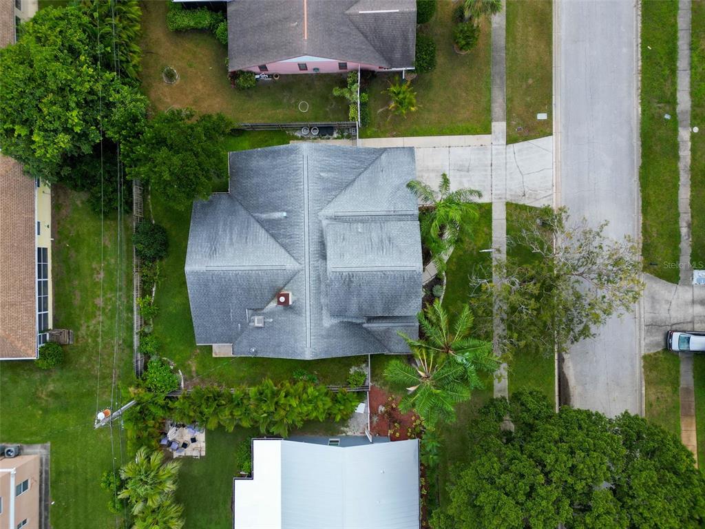 640 Kenneth Way Tarpon Springs, FL 34689 - Photo 63 of 84 an aerial view of a house with a yard and garden