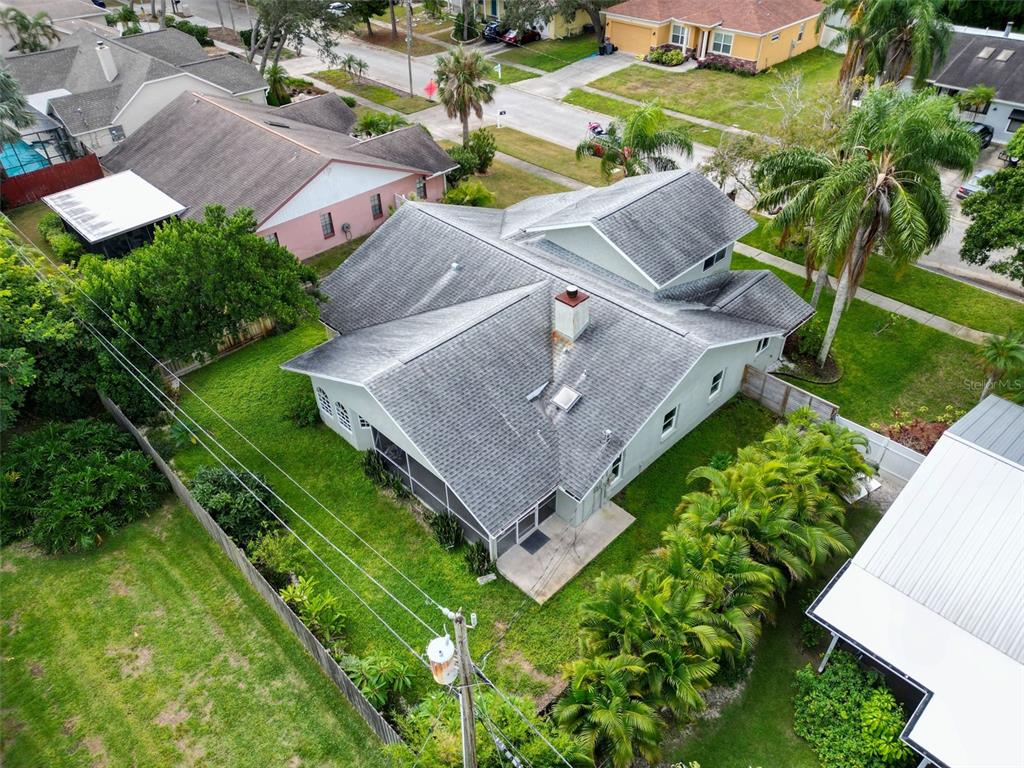 640 Kenneth Way Tarpon Springs, FL 34689 - Photo 65 of 84 an aerial view of a house with a garden