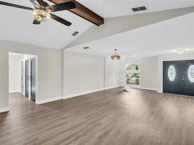 a kitchen with stainless steel appliances granite countertop a sink and a stove
