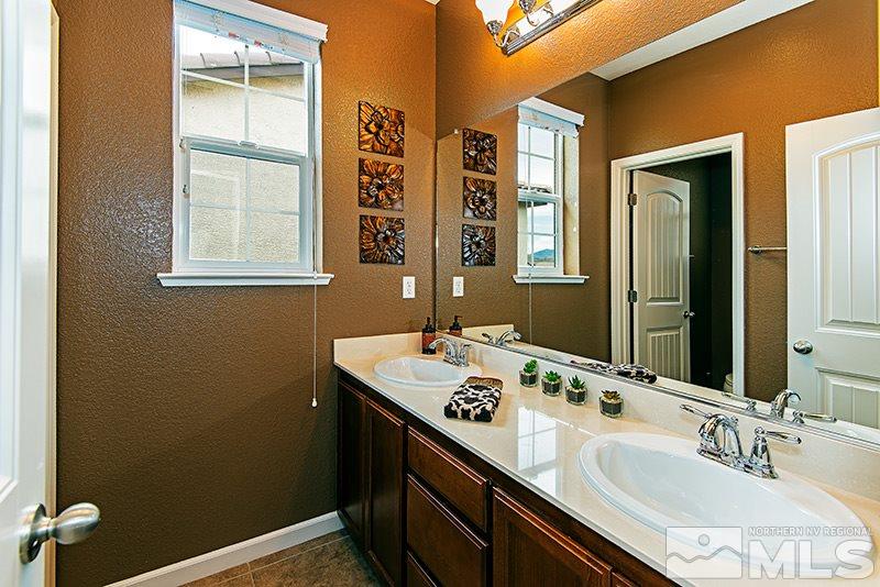 9330 Lost Valley Road Reno, NV 89521 - Photo 20 of 22 a bathroom with a sink double vanity and a window