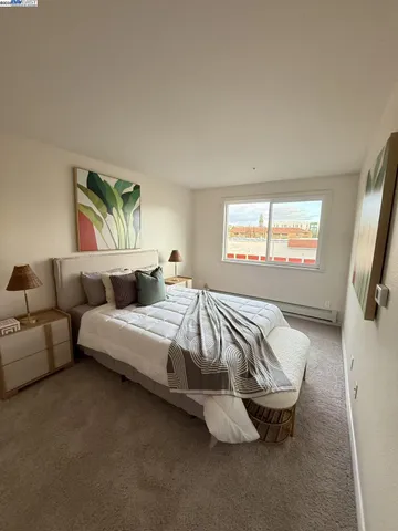 a bedroom with bed and window