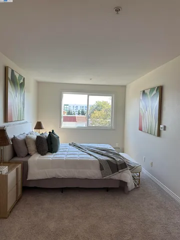 a bedroom with a bed and a couch