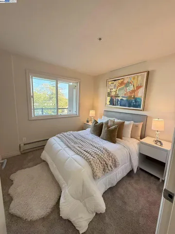 a bedroom with bed and window