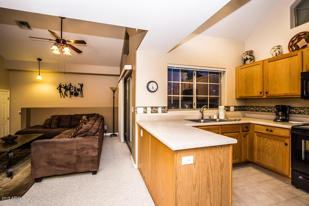 2801 North Litchfield Road, Unit 50 Goodyear, AZ 85395 - Photo 5 of 24 Kitchen and living area