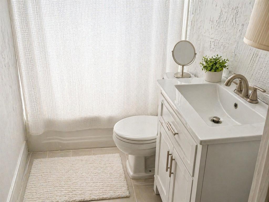 1900 Winter Park Road Winter Park, FL 32789 - Photo 10 of 22 a bathroom with a sink a toilet and shower