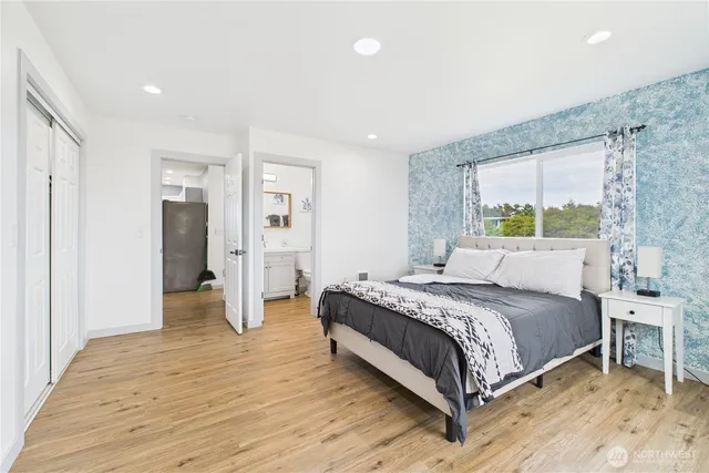 a bedroom with a bed and a walk in closet