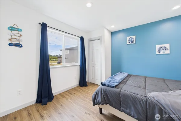 a bedroom with a bed and a table