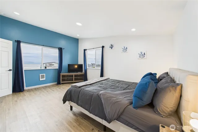 a bedroom with a bed and dresser