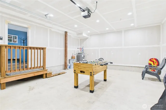 a view of game room with windows