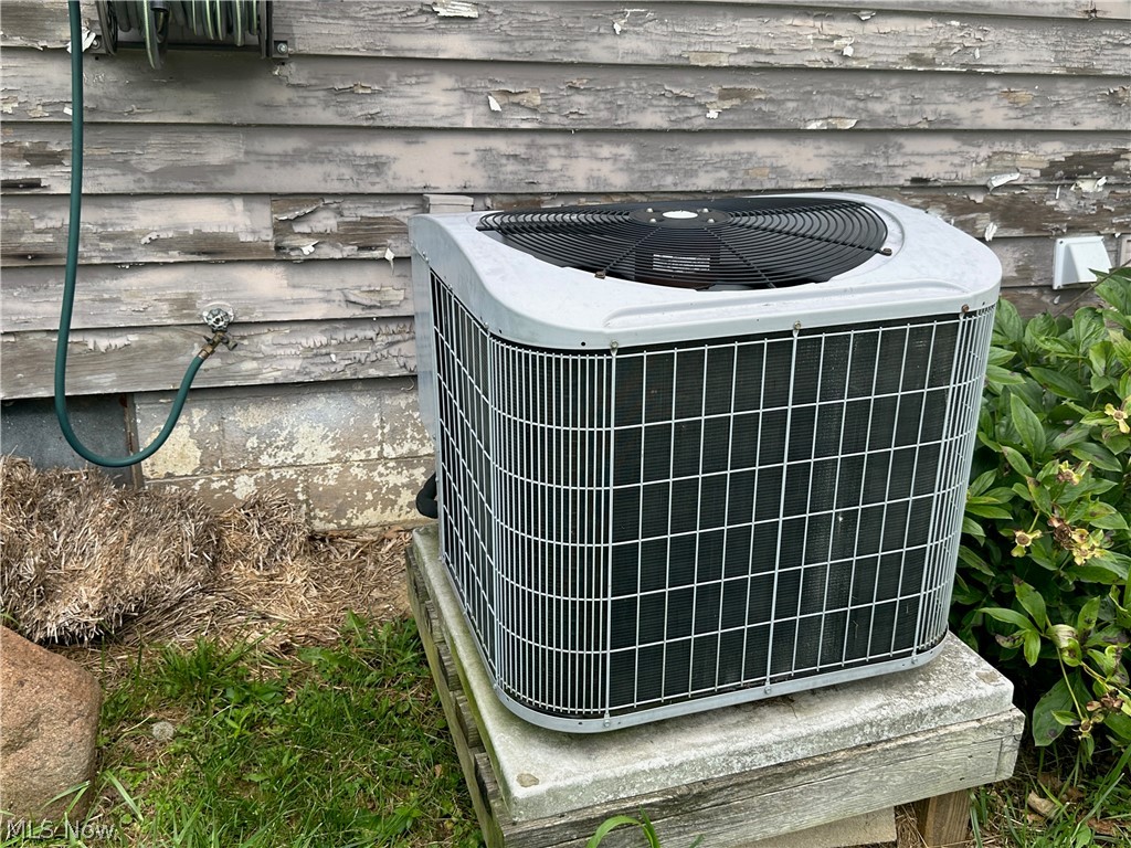 2857 McCoy Road Wooster, OH 44691 - Photo 15 of 19 Exterior details with wood walls and central air condition unit