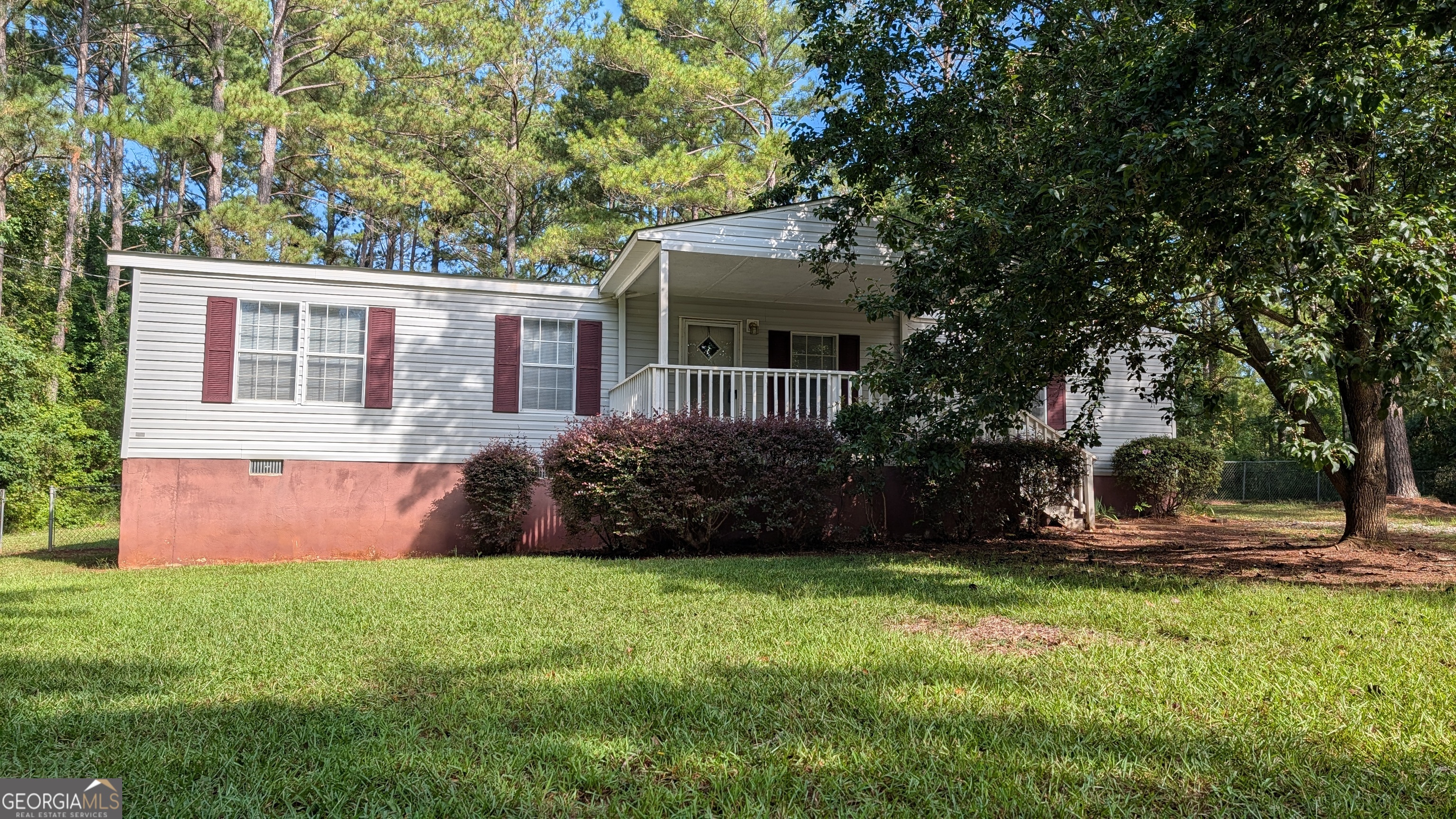 151 Hardy Road Gray, GA 31032 - Photo 1 of 1 a front view of a house with garden