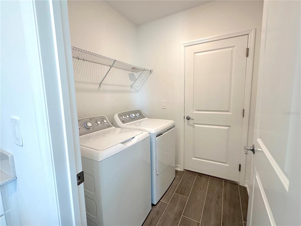118 Inman Boulevard Winter Haven, FL 33881 - Photo 16 of 19 a utility room with dryer and washer