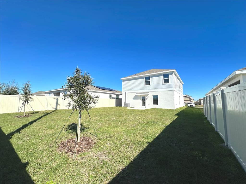 118 Inman Boulevard Winter Haven, FL 33881 - Photo 19 of 19 a view of a house with a yard
