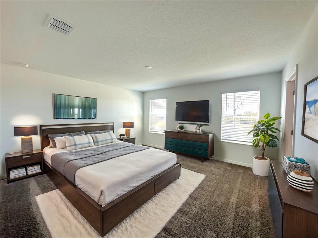 118 Inman Boulevard Winter Haven, FL 33881 - Photo 5 of 19 a bedroom with a bed and a television