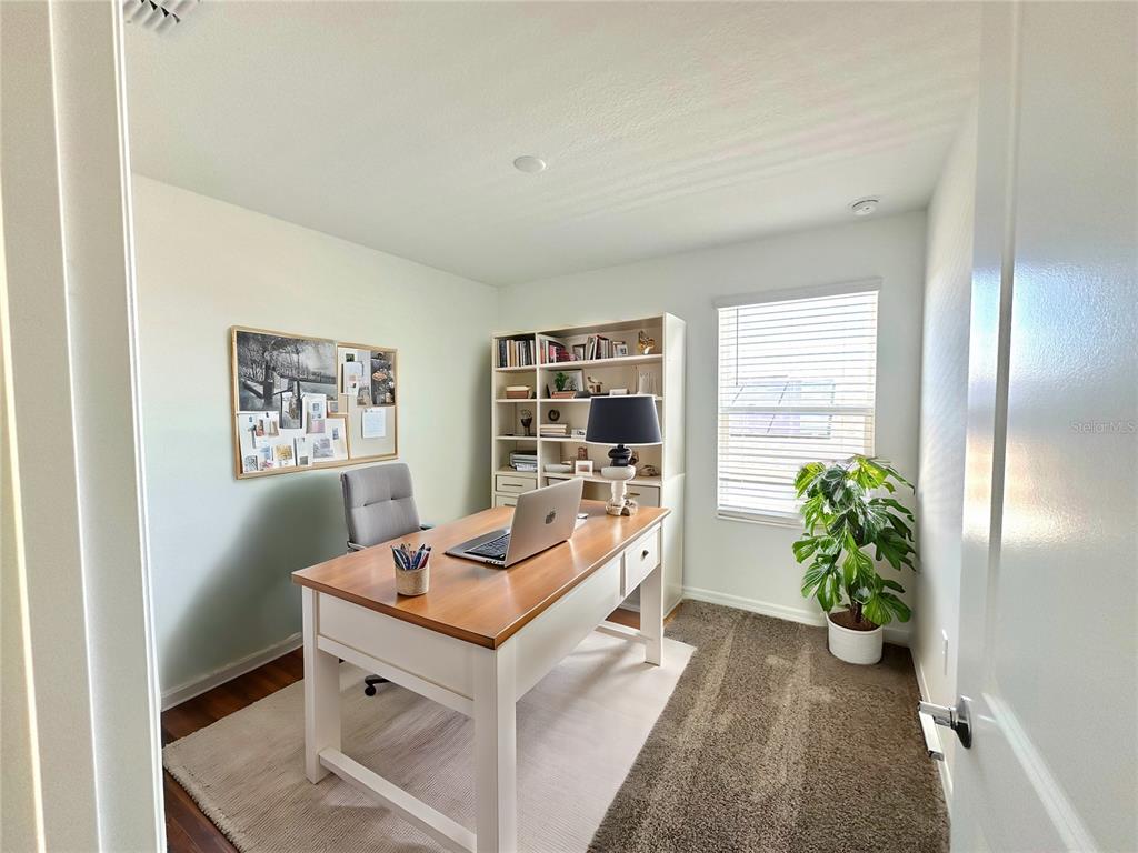 118 Inman Boulevard Winter Haven, FL 33881 - Photo 6 of 19 a view of a workspace with furniture and a window