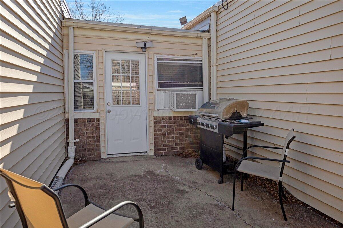 4202 Charles Street Amarillo, TX 79106 - Photo 24 of 27 a backyard of a house with barbeque oven and stairs