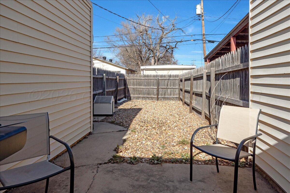 4202 Charles Street Amarillo, TX 79106 - Photo 25 of 27 a view of a chairs and table in the balcony