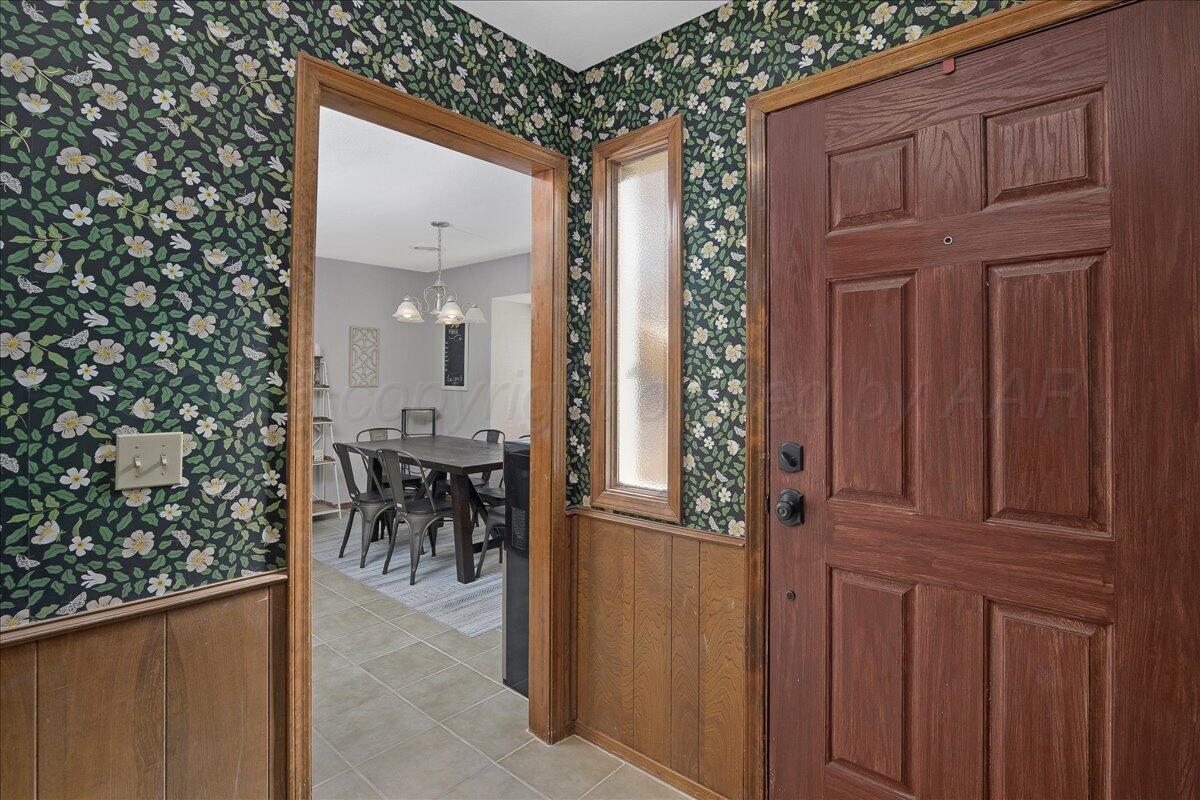 4202 Charles Street Amarillo, TX 79106 - Photo 3 of 27 a view of a entryway door of the house and living room