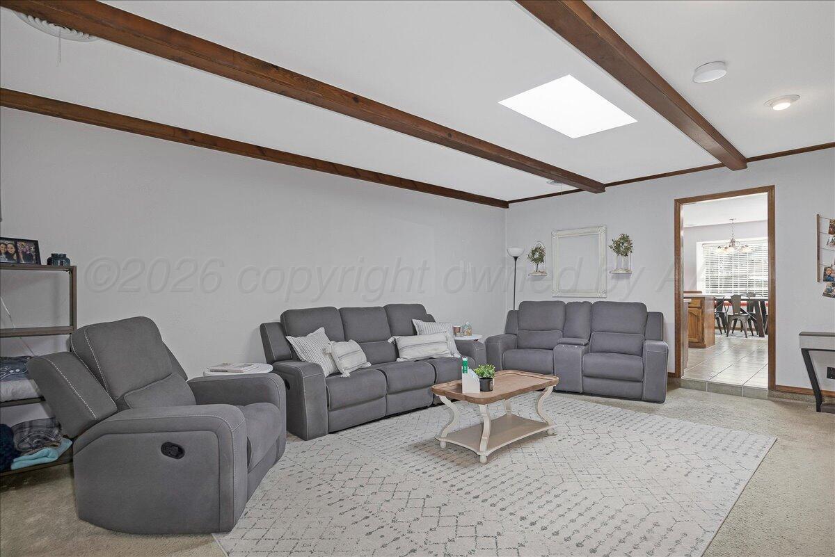 4202 Charles Street Amarillo, TX 79106 - Photo 6 of 27 a living room with furniture and a rug