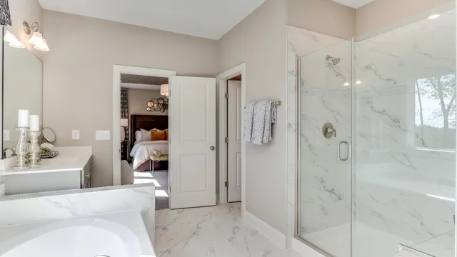 a bathroom with a sink and shower