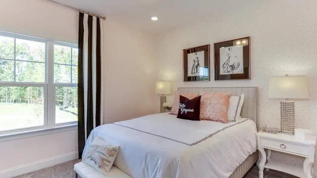 a bedroom with a large bed and a window