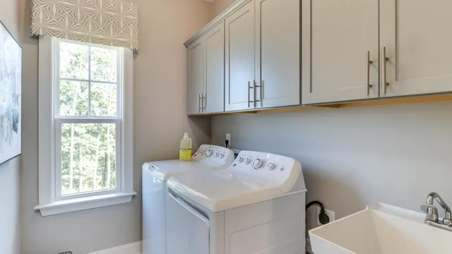 a bathroom with a sink and a window
