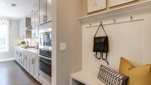 a kitchen with stainless steel appliances a sink and a refrigerator