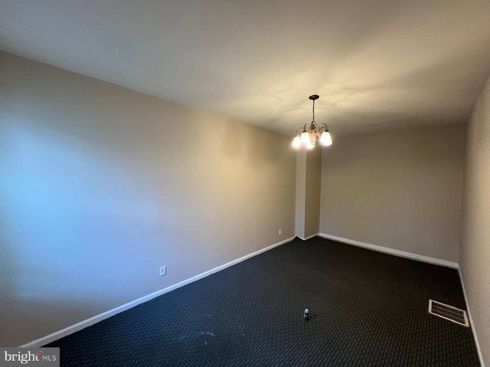 3907 Fairview Avenue Baltimore, MD 21216 - Photo 12 of 25 wooden floor in an empty room