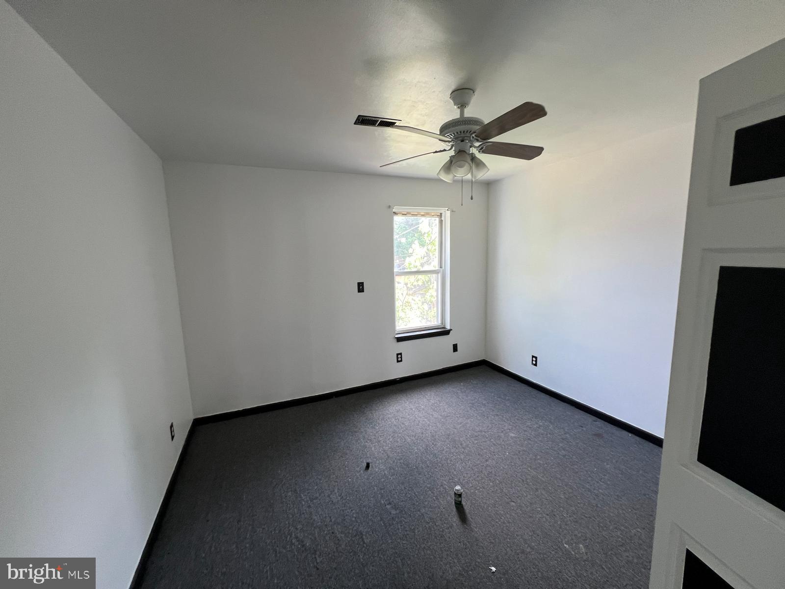 3907 Fairview Avenue Baltimore, MD 21216 - Photo 15 of 25 a view of a livingroom with a ceiling fan and window