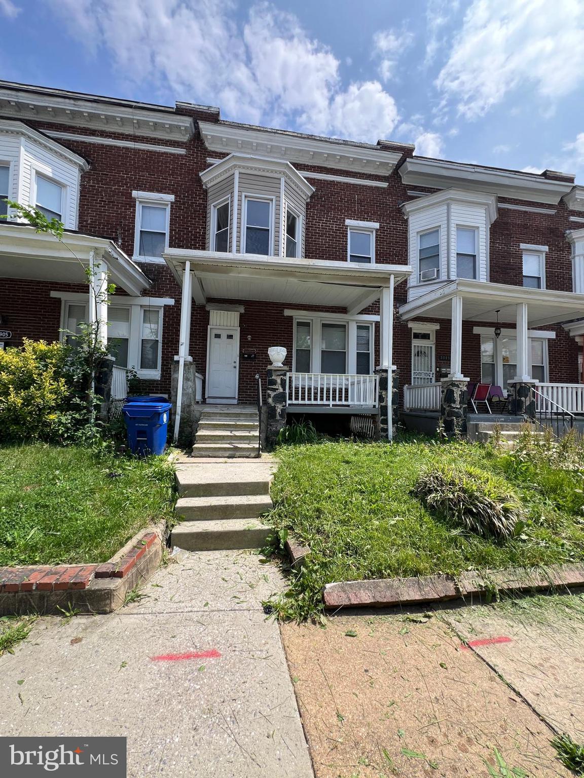 3907 Fairview Avenue Baltimore, MD 21216 - Photo 2 of 25 a front view of a house with a garden