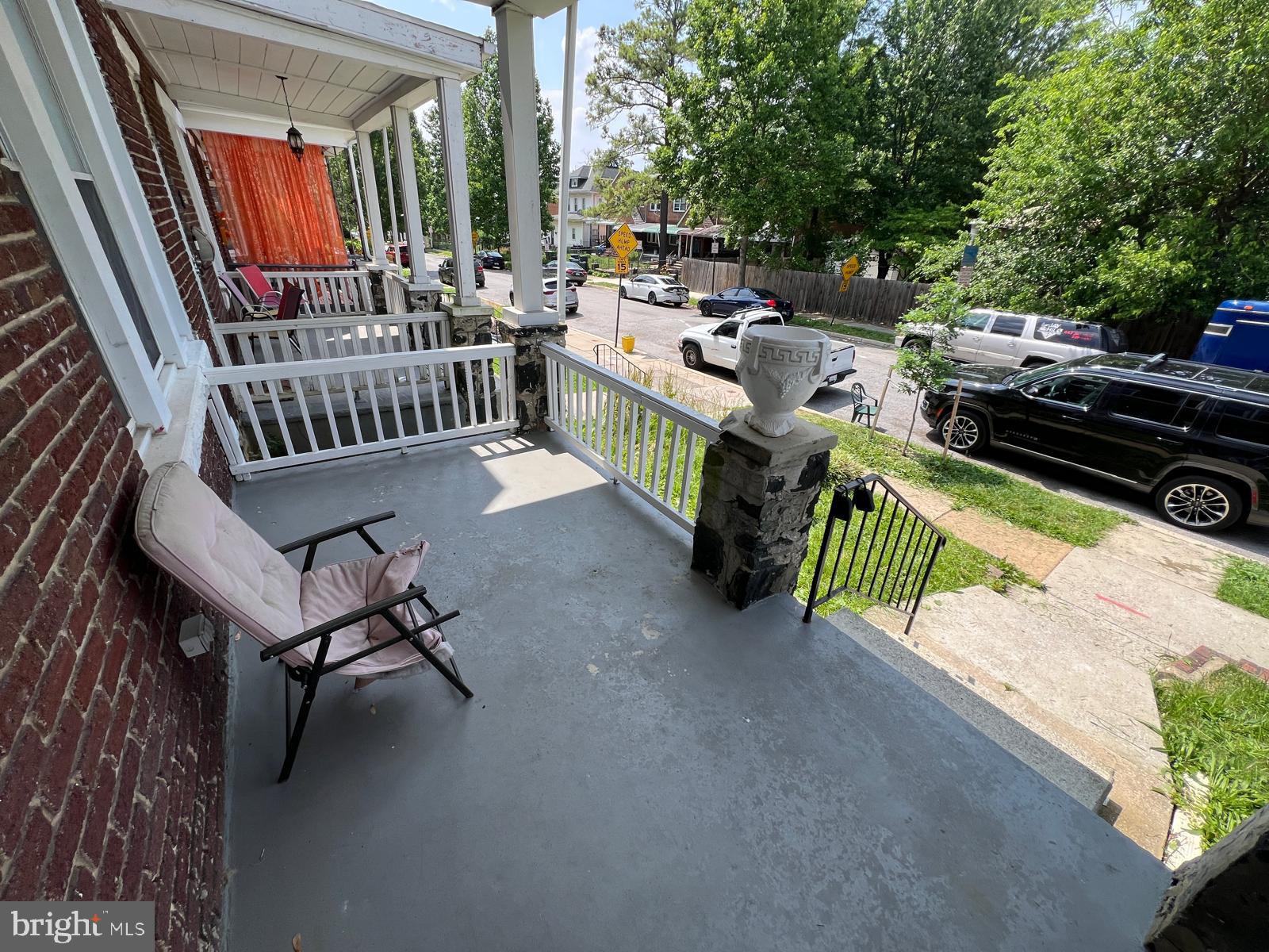3907 Fairview Avenue Baltimore, MD 21216 - Photo 4 of 25 a view of a patio with chairs and a table