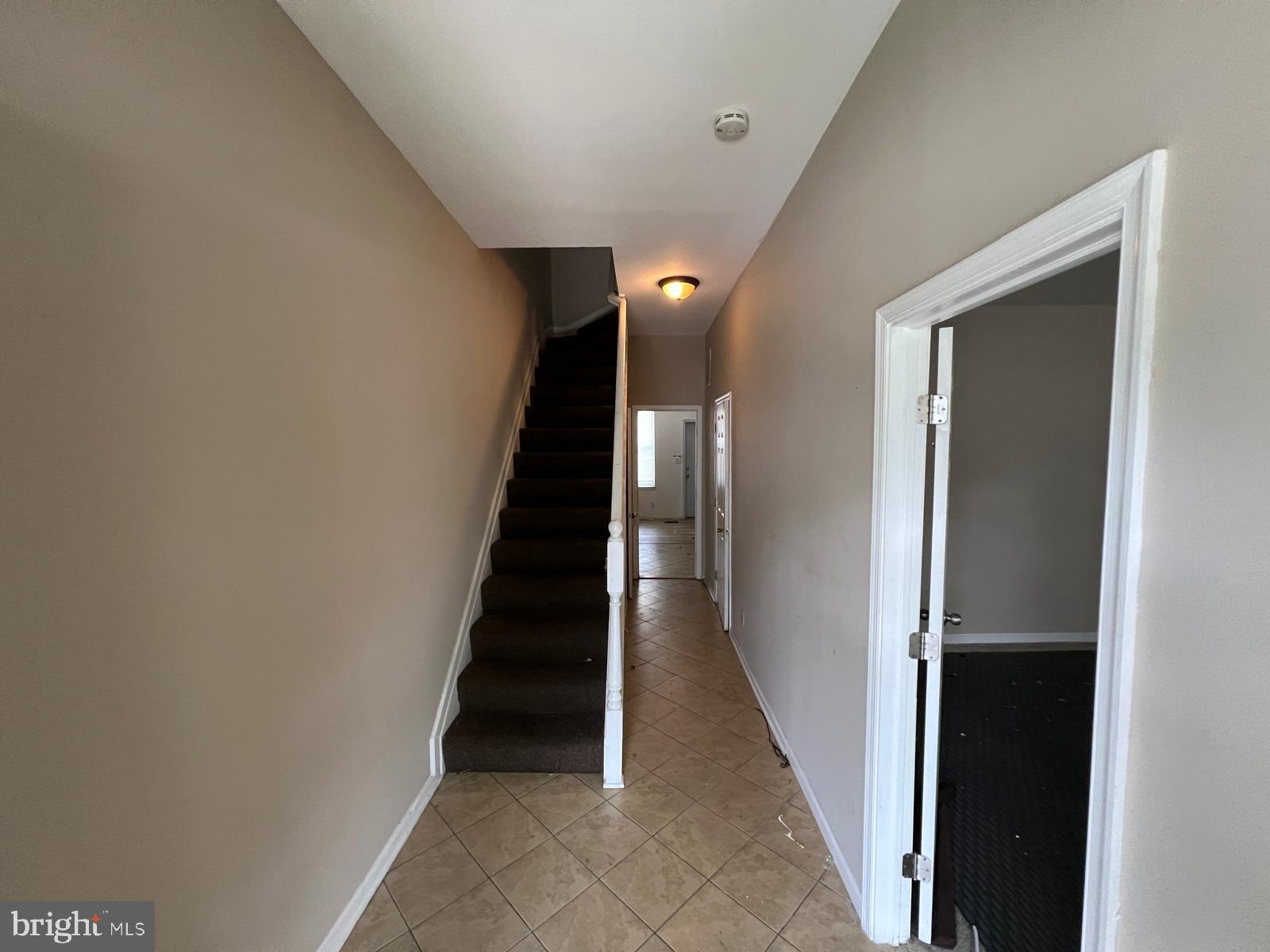 3907 Fairview Avenue Baltimore, MD 21216 - Photo 6 of 25 a view of a hallway with wooden floor