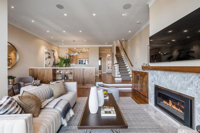 a hallway with fireplace and wooden floor