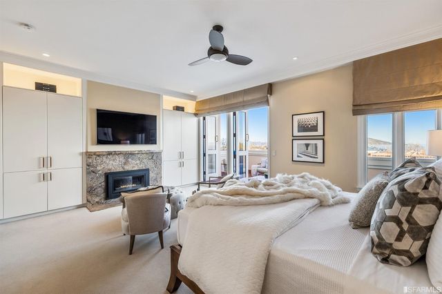 a bed room with a bed and a large window