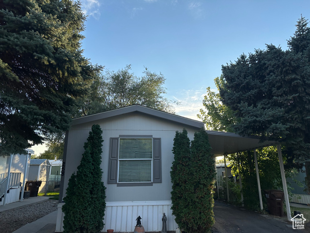 View of home's exterior featuring a carport
