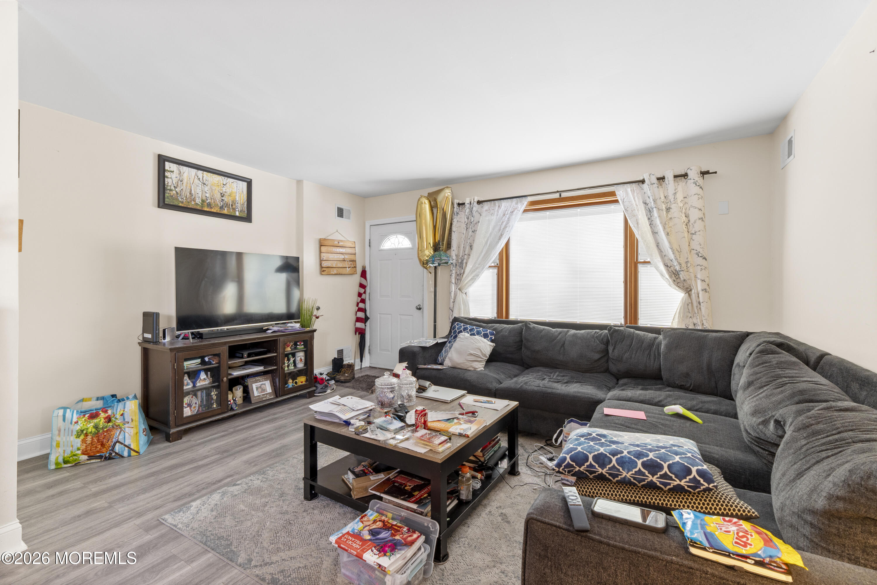 9 Kearney Street, Unit A Keyport, NJ 07735 - Photo 26 of 37 a living room with furniture and a flat screen tv