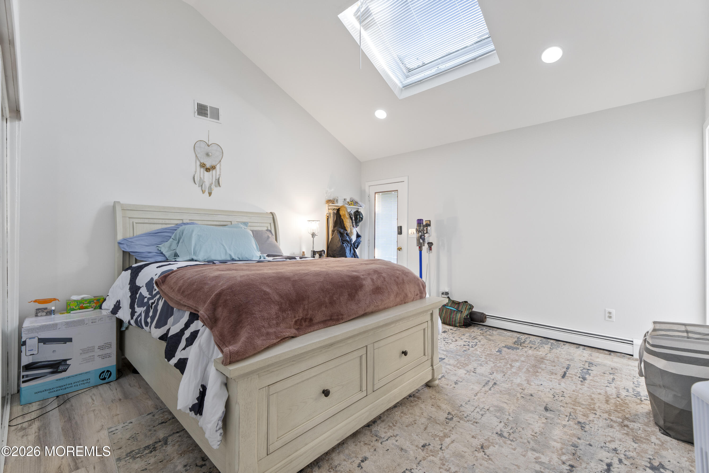 9 Kearney Street, Unit A Keyport, NJ 07735 - Photo 29 of 37 a spacious bedroom with a bed and a window