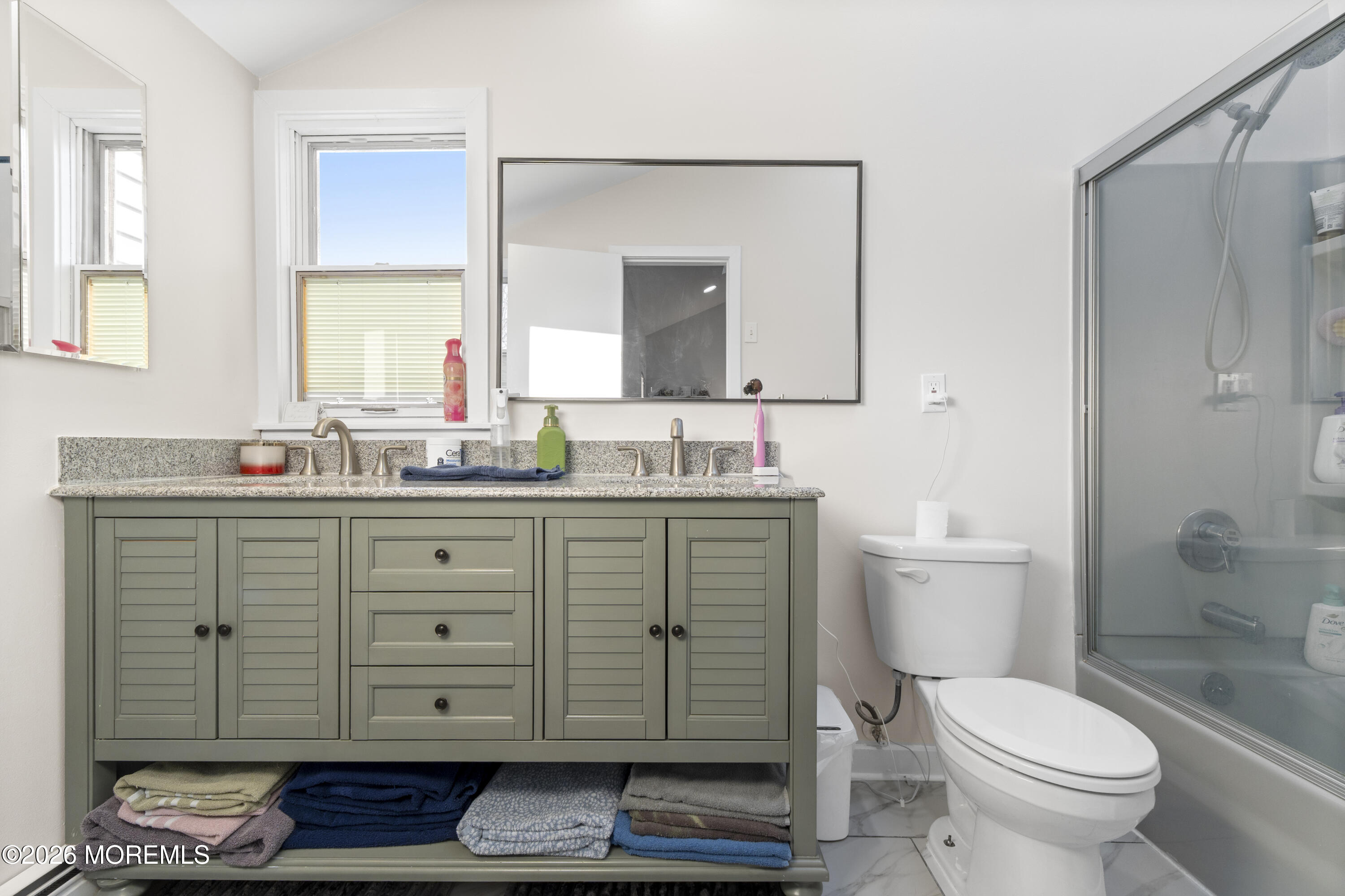 9 Kearney Street, Unit A Keyport, NJ 07735 - Photo 30 of 37 a bathroom with a granite countertop toilet sink and mirror