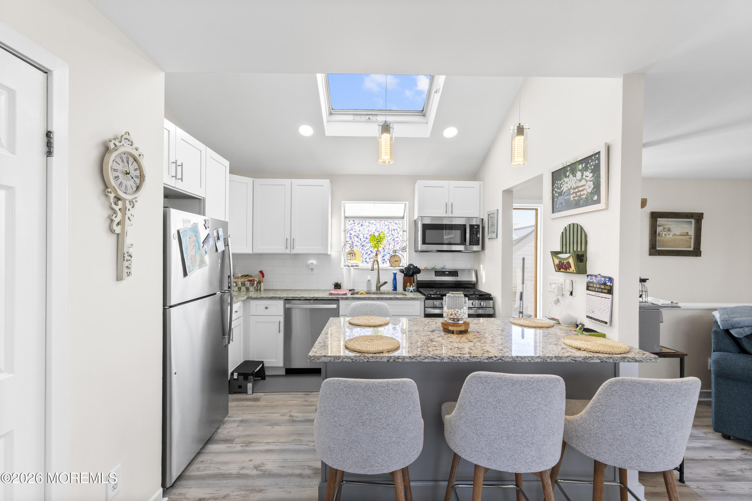 9 Kearney Street, Unit A Keyport, NJ 07735 - Photo 34 of 37 a kitchen with refrigerator and chairs