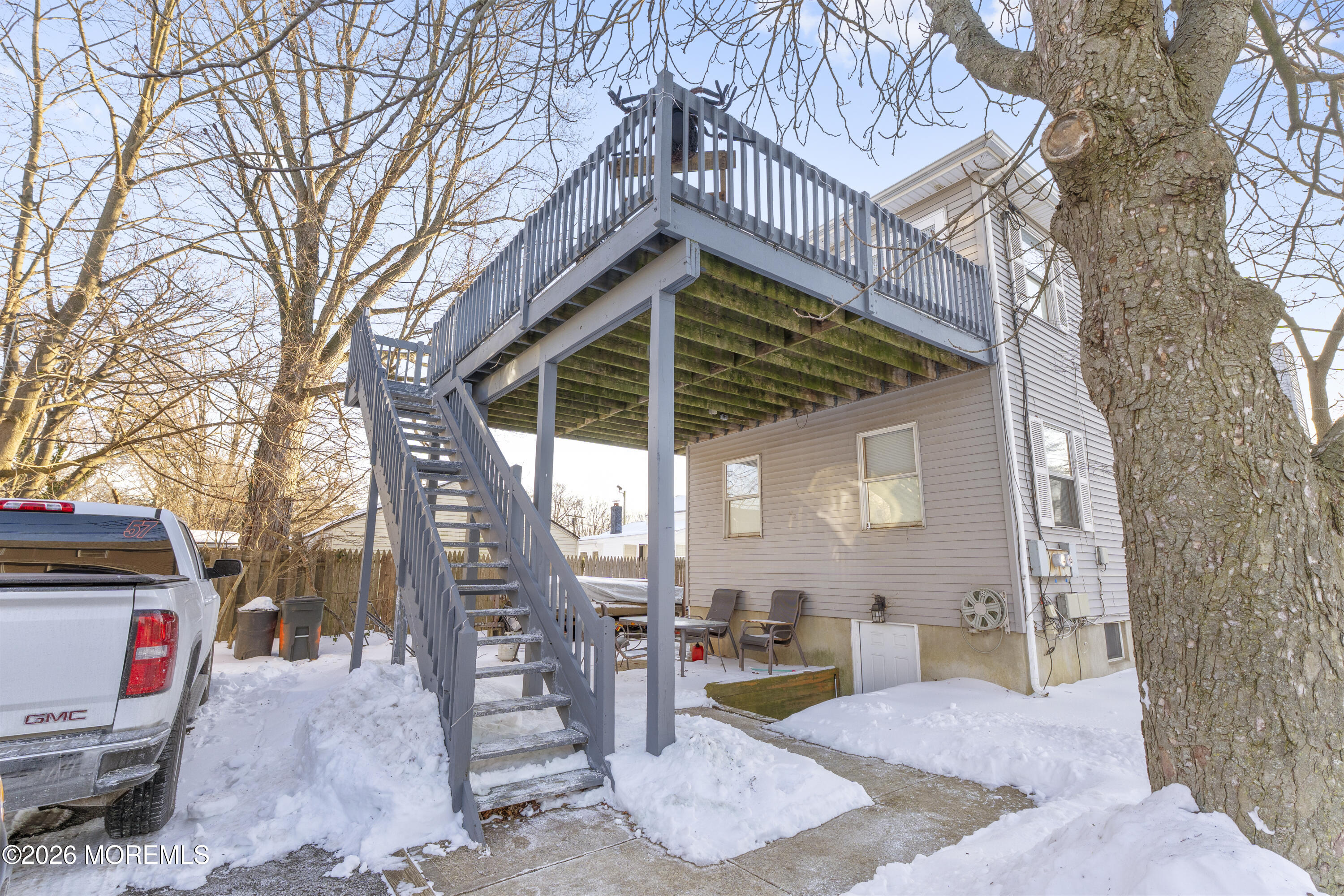9 Kearney Street, Unit A Keyport, NJ 07735 - Photo 35 of 37 a view of a chairs and tables in the back yard of the house