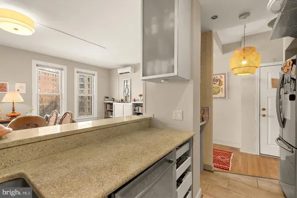 a kitchen with stainless steel appliances granite countertop a sink and refrigerator