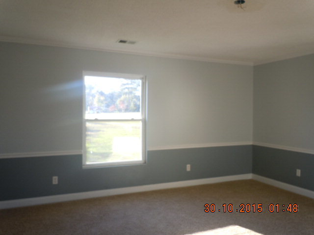 2209 Lower Hartley Bridge Road Byron, GA 31008 - Photo 14 of 15 an empty room with a window